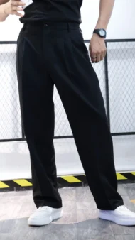 BLACK RELAXED FIT PLEATED TROUSERS